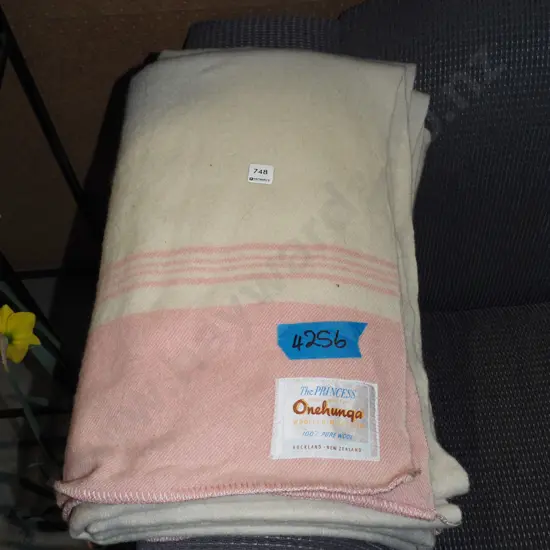 pink and white woollen blanket
