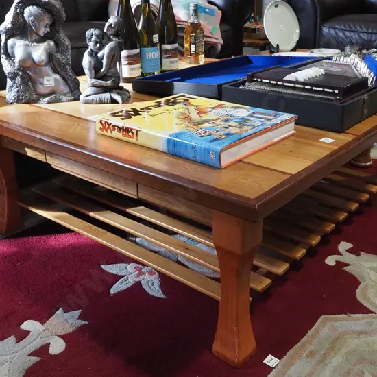 homemade table made from mixed timbers with slat magazine rack H400 W1040 D1050