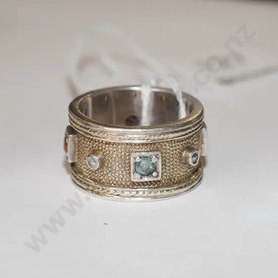 modern gilded sterling silver ring with inlaid gemstones