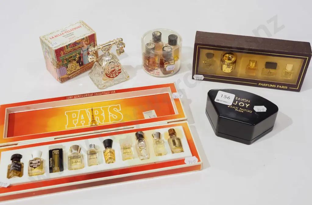 assorted miniature perfumes & Avon telephone cologne bottle (empty) Image 1++