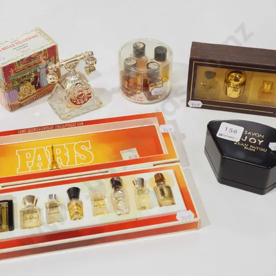 assorted miniature perfumes & Avon telephone cologne bottle (empty)