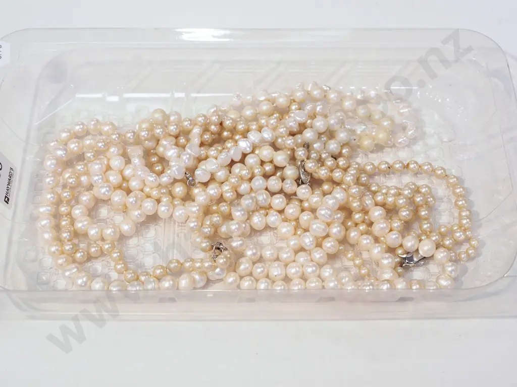 tray; pearl? necklaces Image 1++
