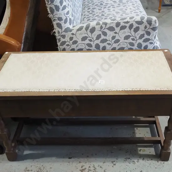 dark stained uphostered topped piano stool, marks to upholstery