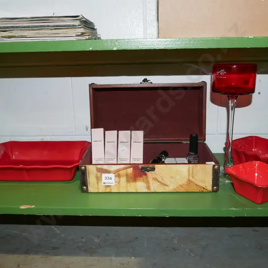 shelf; red ceramic bowls, trinket box, skin care miniatures, red glass goblet etc