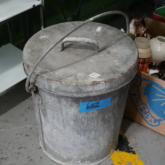 galvanised lidded ash can