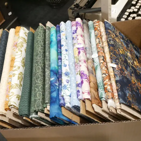 box of fabric pieces