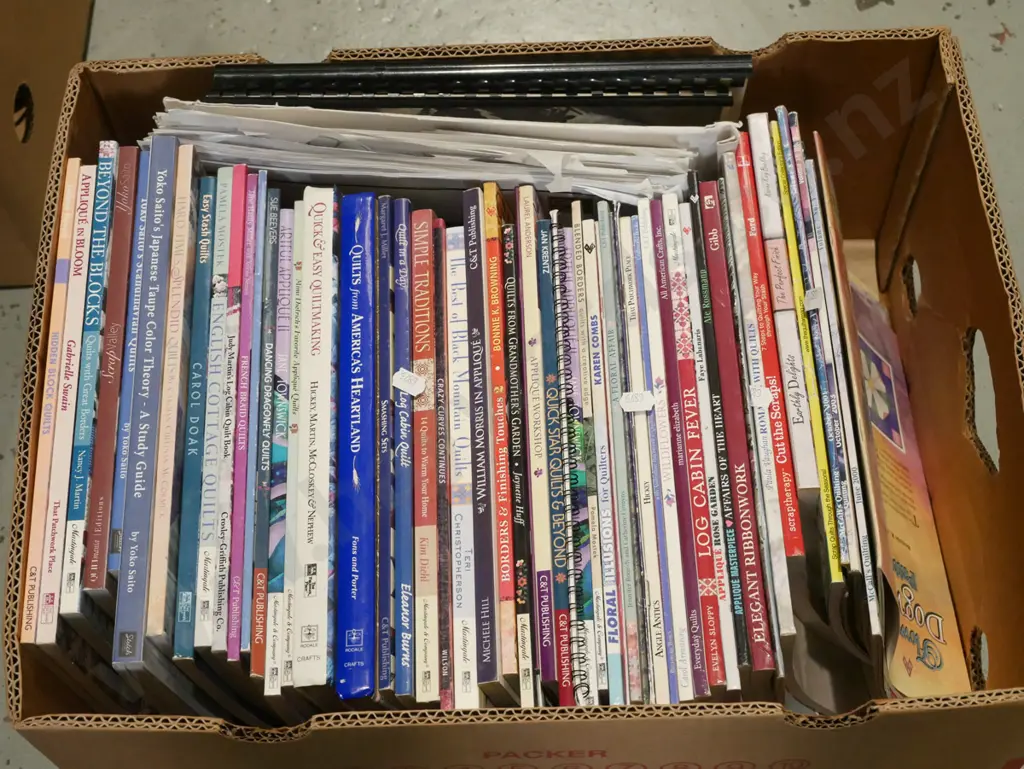box of quilting and other craft books Image 1++