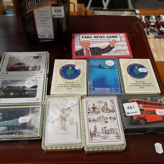 various playing cards including Fake News game, 2 packs of CIA Iraq War cards