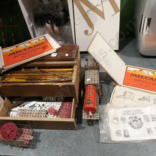 box of vintage Mecanno, model train and tender, instruction books