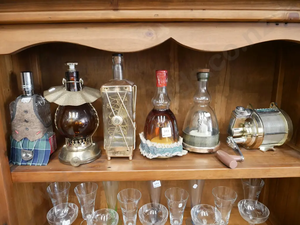 shelf of novelty decanters Image 1++