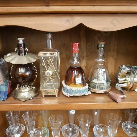 shelf of novelty decanters