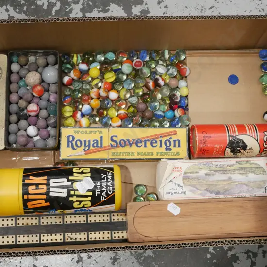 box; marbles, pick up sticks, pencils etc