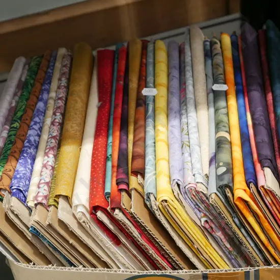 box of fabric pieces