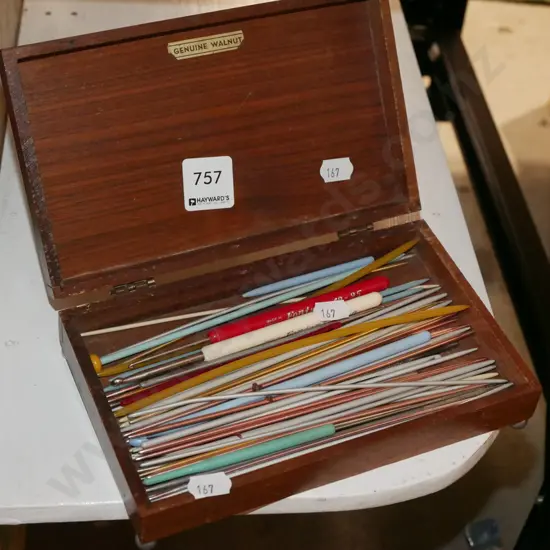 cigar box and small knitting needles