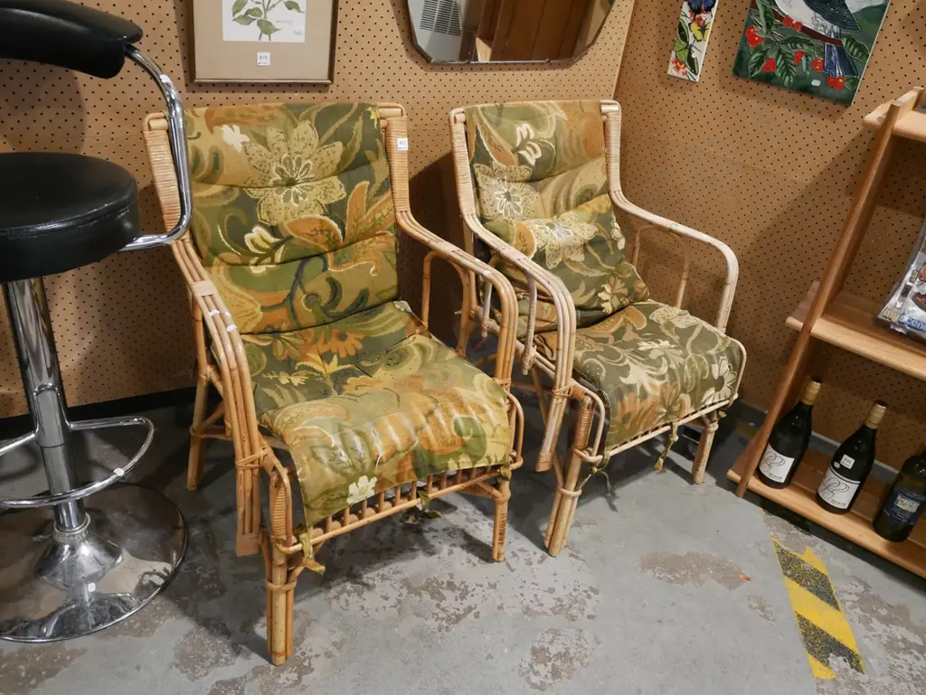 pair of matching cane armchairs with floral cushions Image 1++