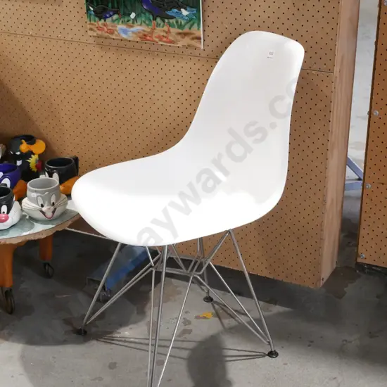chrome and white plastic chair