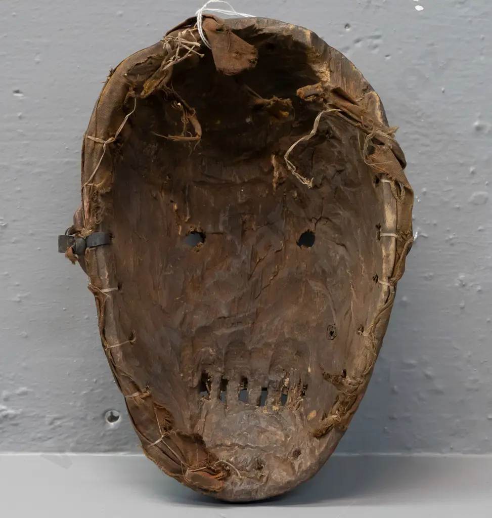 carved wood Fipa mask (Tanzania?) with earth pigment, remnant fabric liner around edge, has some chips H-230 W-170 Image 1++