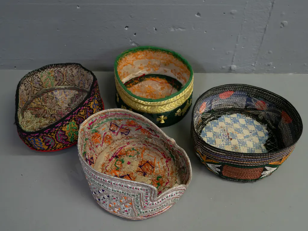 4 skullcaps from Pakistan and Afghanistan - multi colour woven fabric, metallic thread, mirrors etc Image 1++