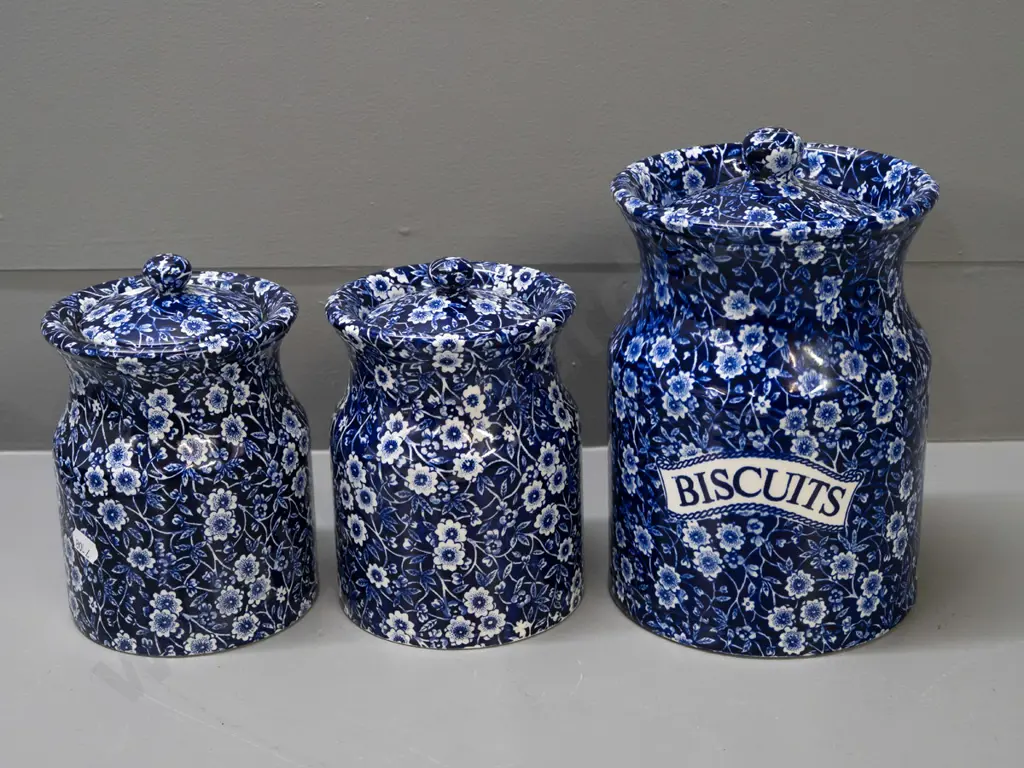 3 Burleigh Calico cobalt blue lidded canisters - one with Ballantynes label, larger marked "Biscuits" is H-210 D-140 Image 1++