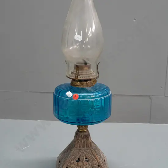 vintage kerosene lamp with blue glass tank, pierced cast base and clear chimney, knob marked Miller - small crack to