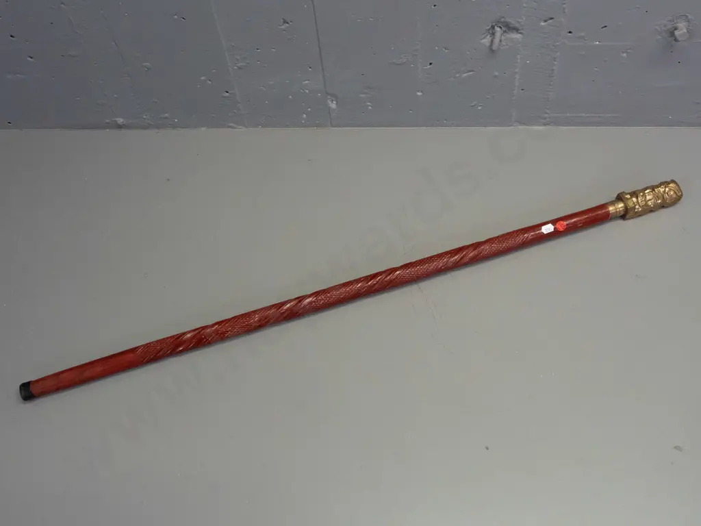 carved & painted timber walking stick with polished hollow cast brass Maori motif handle - some wear to paint L-950 Image 1++