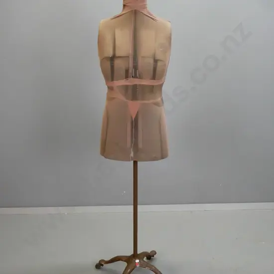 vintage adjustable dress form on cast iron base marked "Acme Form" on wooden casters, with nylon covering - corrosion to