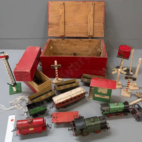 vintage Hornby 'O' gauge railway items with 2 wind-up locomotives, assorted rail cars, signals, water tank, etc in
