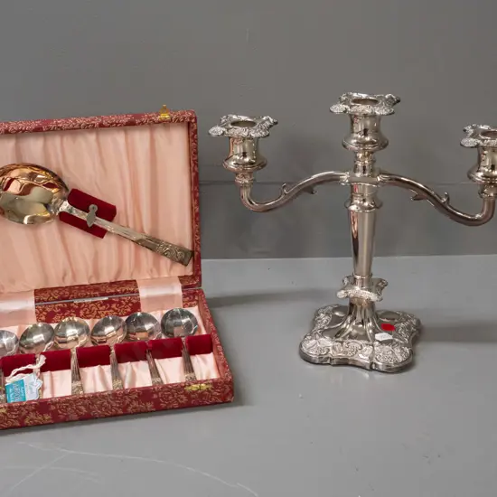 cased Angora silver-plated set of 6 spoons and a serving spoon and an English plated 3-candle candelabra H-250 W-290