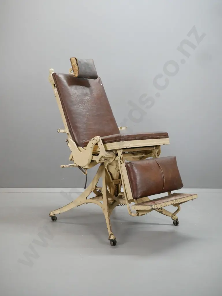 vintage dentist's/barber's chair with cast metal frame, 4-point base on large casters, elaborate adjustable spring and Image 1++