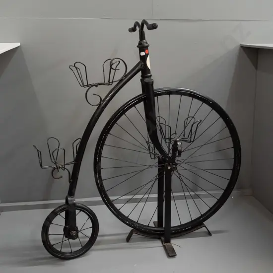 retro plant stand in the form of a penny farthing bicycle with rubber tyres, 4 plant holders, set on stand supporting