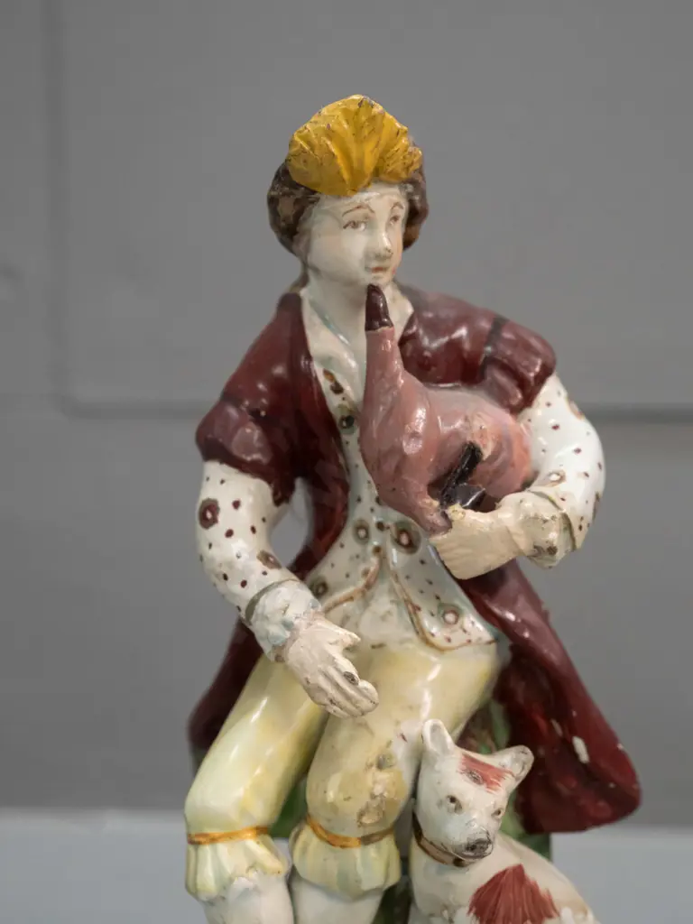 antique seated musician with dog figure - note on base attributes to Chelsea Derby - and a small Staffordshire spaniel. Image 1++