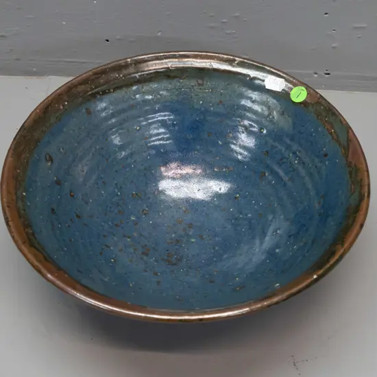 Barry Brickell New Zealand studio pottery bowl -  tenmoku glaze with blue inner, glaze filled back stamp H-115 D-280