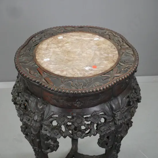Chinese hardwood plant stand w/ marble insert in top, pierced carved floral panels, 5 carved legs on carved dragon feet