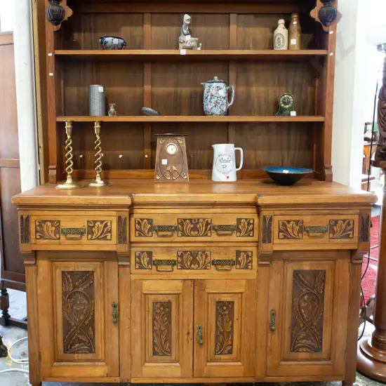 late Victorian walnut and mixed timber open-shelf sideboard with inverted break front, 4 drawers and 4 panelled doors