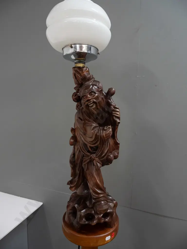 standard lamp made from Chinese carved hardwood figure attached to colonial turned kauri and rimu base, with electric Image 1++