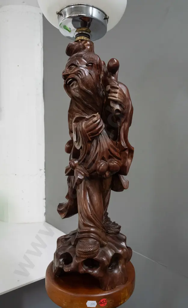 standard lamp made from Chinese carved hardwood figure attached to colonial turned kauri and rimu base, with electric Image 1++