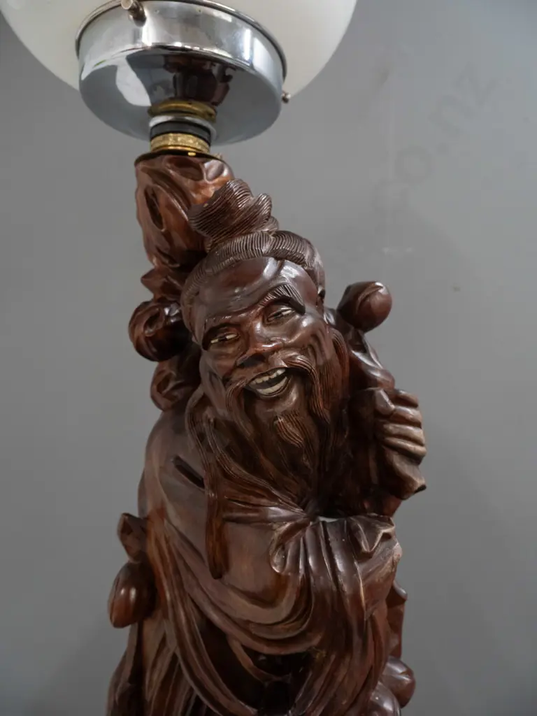 standard lamp made from Chinese carved hardwood figure attached to colonial turned kauri and rimu base, with electric Image 1++