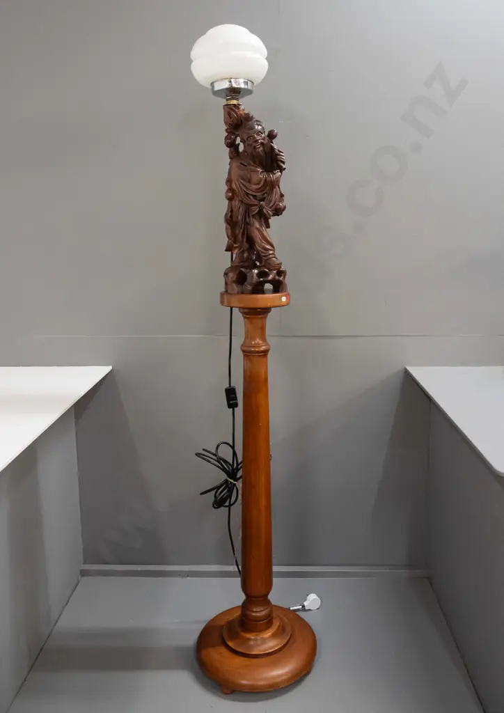 standard lamp made from Chinese carved hardwood figure attached to colonial turned kauri and rimu base, with electric Image 1++