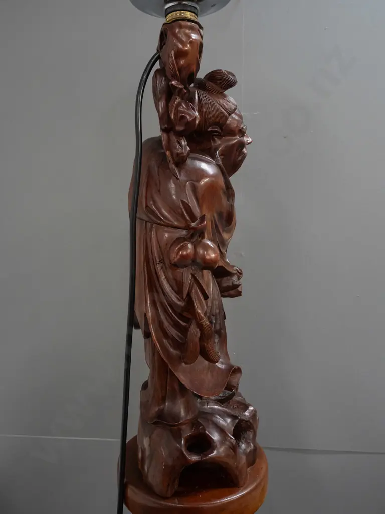 standard lamp made from Chinese carved hardwood figure attached to colonial turned kauri and rimu base, with electric Image 1++