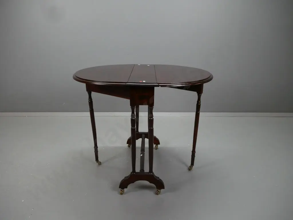 reproduction mahogany oval Sutherland gate leg table with turned legs, supports and stretcher base - Blakeleys Kaiapoi Image 1++