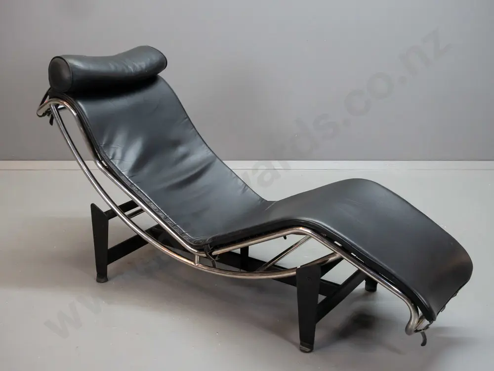 Corbusier LC4 style chrome and black leather reclining lounger on black steel stretcher base, nylon strapping under Image 1++