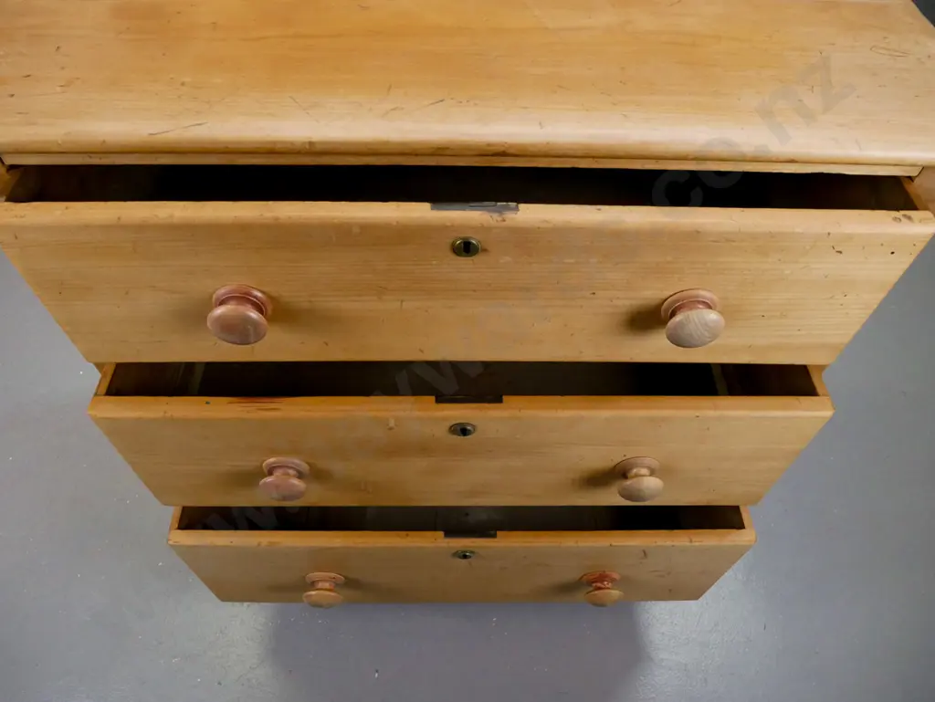 New Zealand colonial kauri 3-drawer round-cornered chest on bun feet w/brass locks and escutcheons, wooden knobs. Splits Image 1++