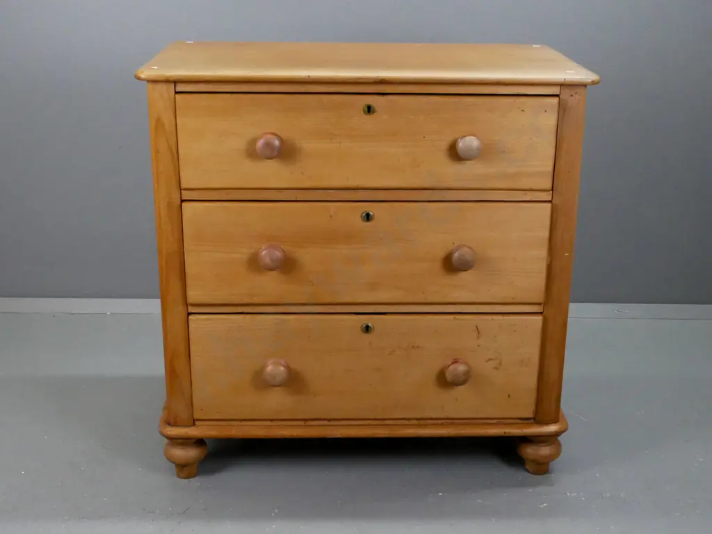 New Zealand colonial kauri 3-drawer round-cornered chest on bun feet w/brass locks and escutcheons, wooden knobs. Splits Image 1++