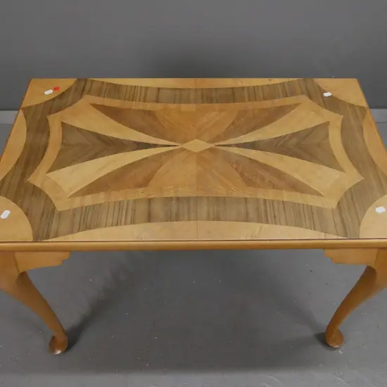 kauri cab-leg occasional table with inlaid walnut, rewa-rewa and other mixed timbers top. Small veneer repair in top