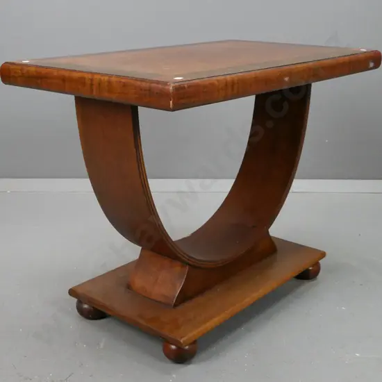 vintage art deco walnut and mahogany table with veneered cross-banded top, laminate hoop base on platform with bun feet