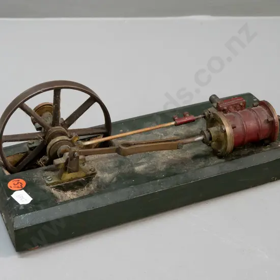 vintage stationery piston driven flywheel on wooden base, pulley wheel marked Meccano - age wear H-100 L-260 W-100