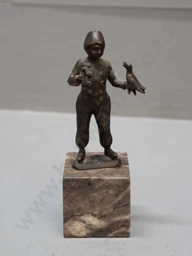 small bronze figure on polished stone base - boy with bird - hard to read markings, see photos H-125 Image 1++