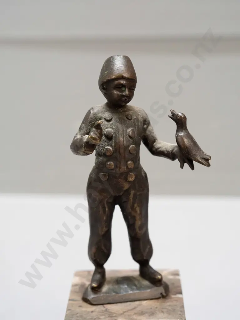 small bronze figure on polished stone base - boy with bird - hard to read markings, see photos H-125 Image 1++