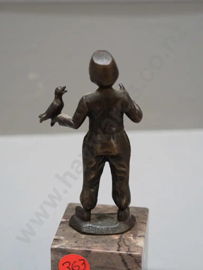 small bronze figure on polished stone base - boy with bird - hard to read markings, see photos H-125 Image 1++