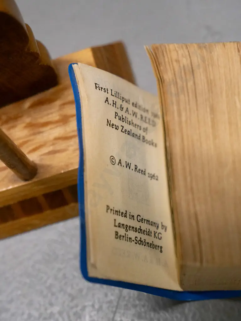 miniature Lilliput Maori Place Names book in mixed timber sovereign ware tiki motif holder - book 1962 AW & AH Reed H-70 Image 1++